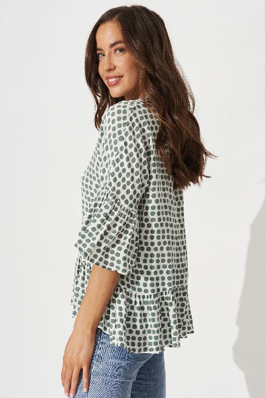 relia-top-in-white-with-green-polka-dot