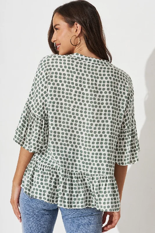 relia-top-in-white-with-green-polka-dot